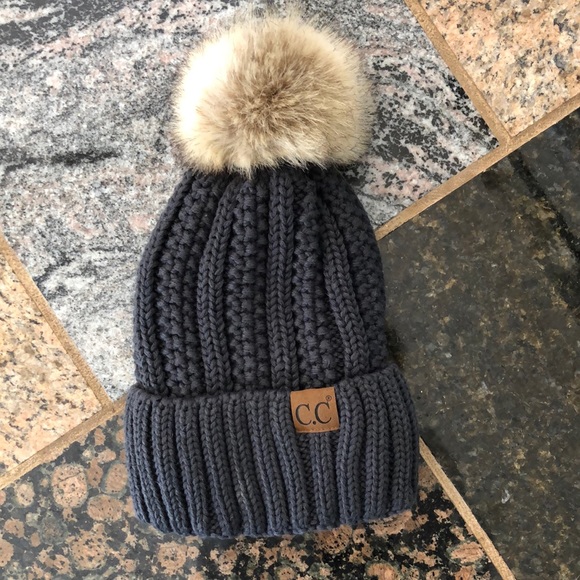 C.C Accessories - New without tag gray lined knit beanie/hat with faux fur Pom.